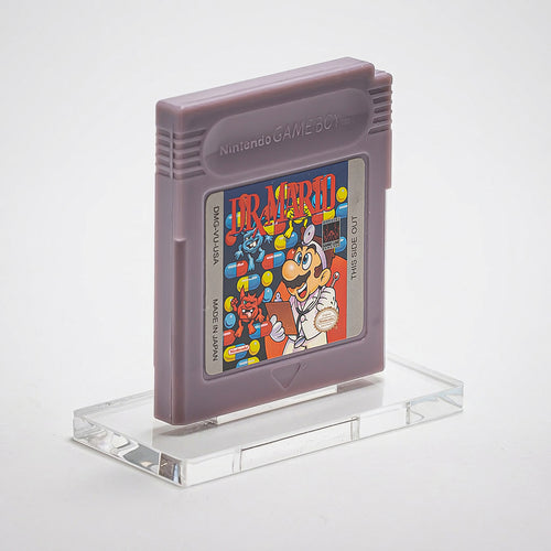 Nintendo Game Boy cartridge of Dr. Mario on a clear stand with a white background